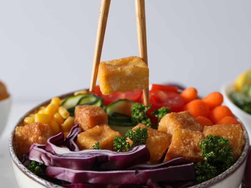Cubes of tofu soak up the spices